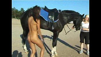 In natures garb legal age teenager riding a horse at the beach turns heads